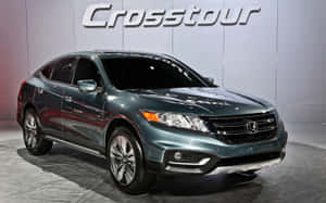 Stylish Honda Crosstour Driving On A Scenic Road Wallpaper