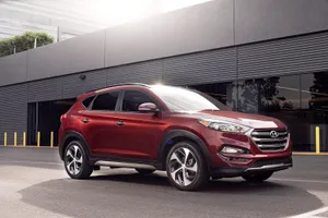 Stylish Hyundai Tucson On A Scenic Drive Wallpaper