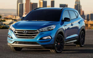 Stylish Hyundai Tucson On Open Road Wallpaper