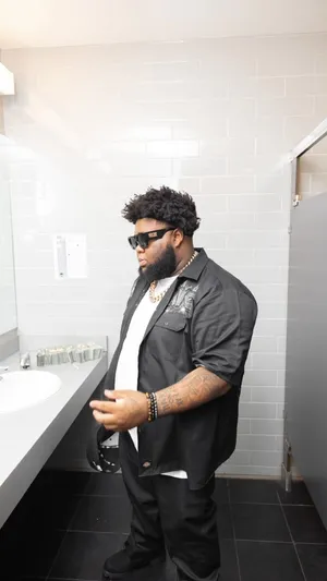 Stylish_ Man_ In_ Bathroom_ Aesthetic.jpg Wallpaper