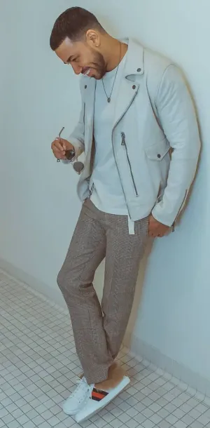 Stylish Man Leaning Against Wall Wallpaper