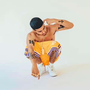 Stylish Man Orange Basketball Shorts Wallpaper