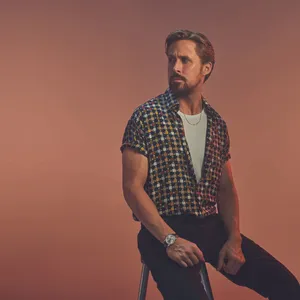 Stylish Man Seated Portrait Wallpaper