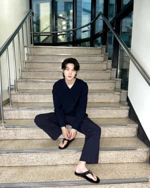 Stylish_ Man_ Sitting_on_ Stairs Wallpaper