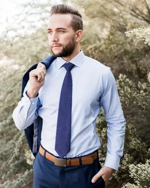 Stylish Man Wearing Navy Blue Tie Wallpaper