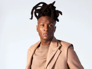 Stylish Manin Beige Suit Wallpaper