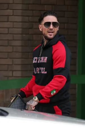 Stylish Manin Red Black Hoodieand Sunglasses Wallpaper