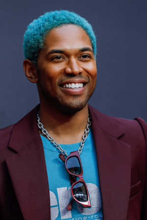 Stylish Manwith Blue Hairand Sunglasses Wallpaper