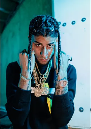 Stylish Manwith Braidsand Jewelry Wallpaper