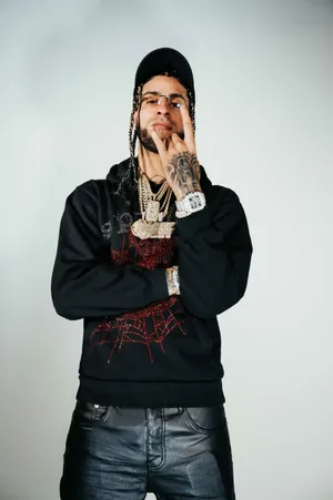 Stylish Manwith Tattoosand Jewelry Wallpaper