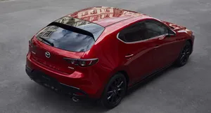 Stylish Mazda 3 Hatchback In Urban Setting Wallpaper