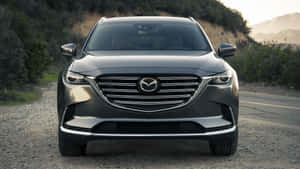 Stylish Mazda Cx-9 On The Road Wallpaper