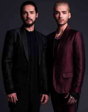 Stylish_ Men_in_ Suits_ Portrait Wallpaper