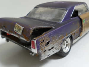 Stylish Metallic Red Sportscar Against A Cityscape Background Wallpaper