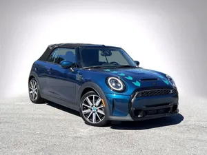 Stylish Mini Cooper S Convertible Cruising In The Sun Wallpaper