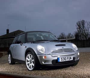 Stylish Mini Cooper S On Open Road Wallpaper