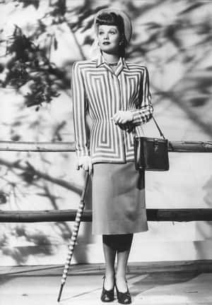 Stylish Model In Black And White Fashion Ensemble Wallpaper