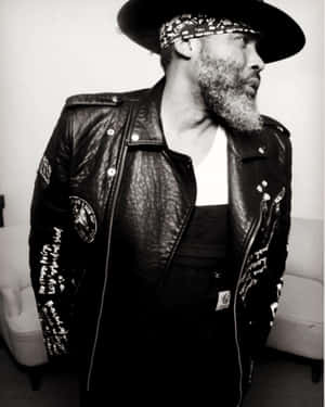 Stylish Music Artistin Leatherand Hat Wallpaper