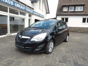 Stylish Opel Meriva In Urban Setting Wallpaper