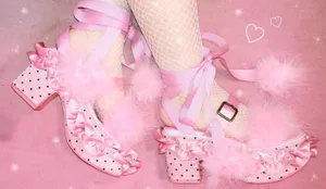 Stylish Pink Shoes On A Wooden Floor Wallpaper