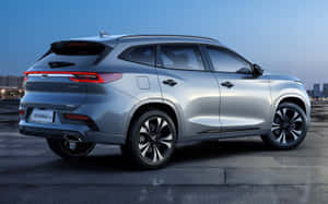 Stylish Red Chery Car On The Road Wallpaper