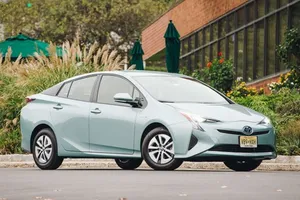 Stylish Red Compact Car In The City Wallpaper