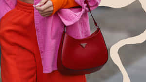 Stylish Red Handbag Hanging On A Wall Wallpaper