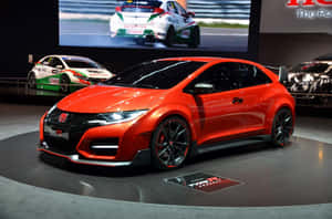 Stylish Red Hatchback In Urban Setting Wallpaper