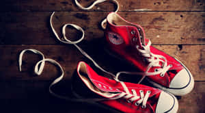 Stylish Red High Heels On A Grayscale Background Wallpaper