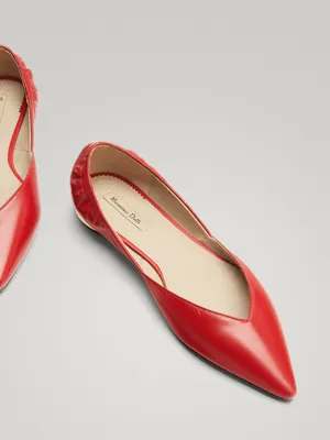 Stylish Red Shoes On A Wooden Floor Wallpaper