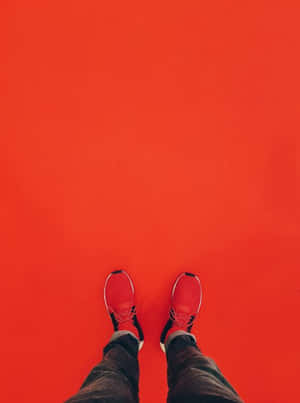 Stylish Red Shoes On A Wooden Floor Wallpaper