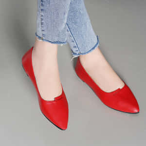Stylish Red Stilettos On Wooden Floor Wallpaper