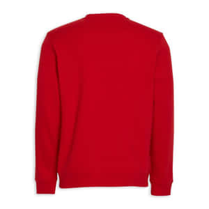 Stylish Red Sweater In A Cozy Setting Wallpaper