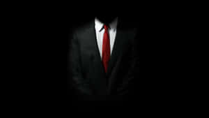 Stylish Red Tie On Dark Suit Wallpaper