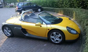 Stylish Renault Sport Spider Speeding Through The Countryside Wallpaper