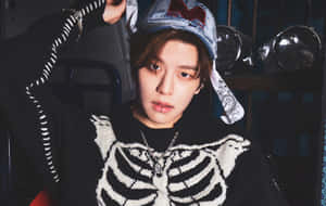 Stylish Seungminin Skeleton Sweaterand Denim Cap Wallpaper