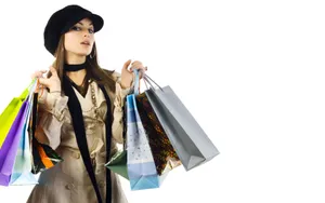 Stylish Shopperwith Colorful Bags Wallpaper