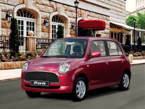 Stylish Silver Daihatsu Trevis On A Bustling City Street. Wallpaper