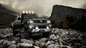 Stylish Tata Motors Automobile On Road Wallpaper