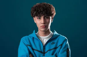 Stylish Teenagerin Blue Track Jacket Wallpaper