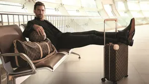 Stylish_ Traveler_at_ Airport_ Terminal_4k Wallpaper