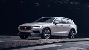 Stylish Volvo V60 Cruising On The Highway Wallpaper