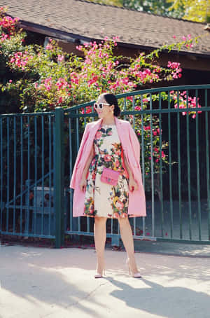 Stylish Woman In A Vibrant Pink Coat Wallpaper