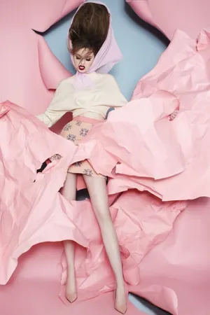 Stylish Woman In Chic Pink Outfit Wallpaper