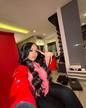 Stylish Woman Red Jacket Posing Indoors Wallpaper