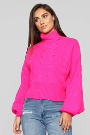 Stylish Woman Wearing A Cozy Pink Sweater Wallpaper