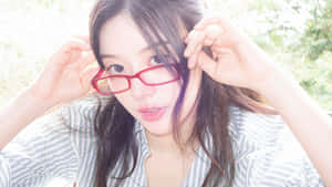 Stylish Woman Wearing Red Glasses Wallpaper