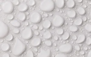 Stylish Woman With Turquoise Jewelry And White Dress Wallpaper