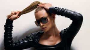 Stylish Womanin Black Leatherand Sunglasses Wallpaper