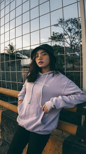 Stylish Womanin Purple Hoodieand Black Beret Wallpaper